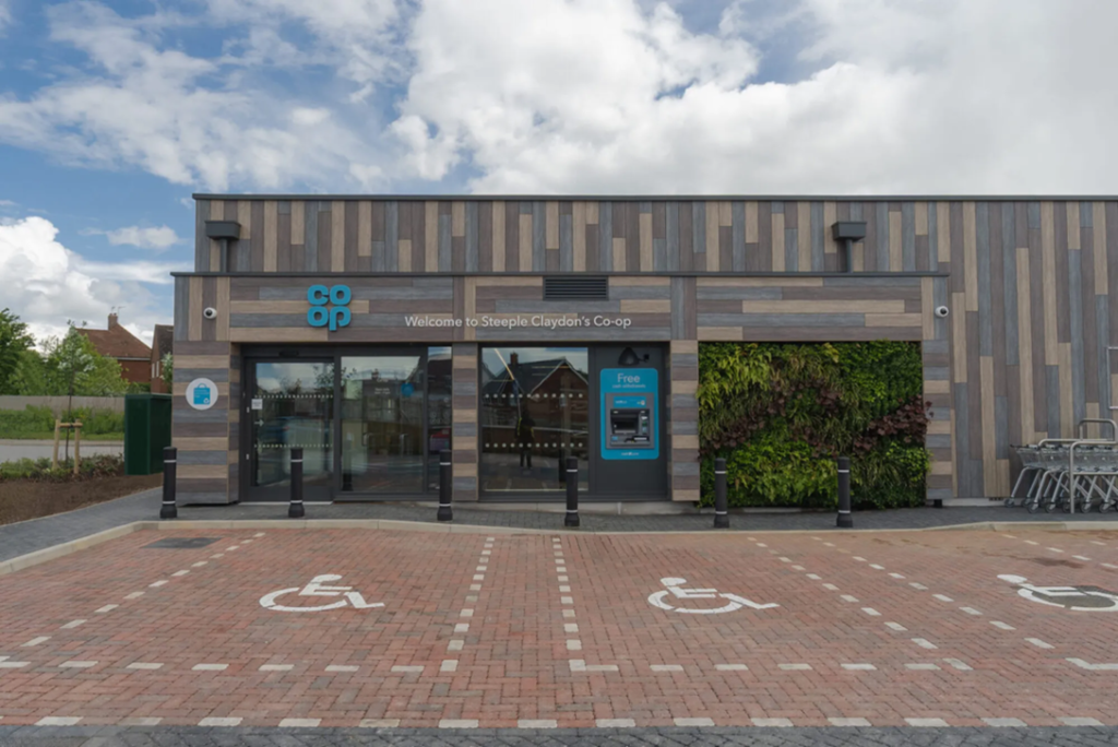 Steeple Claydon coop, showing accessible car parking spaces and a new building